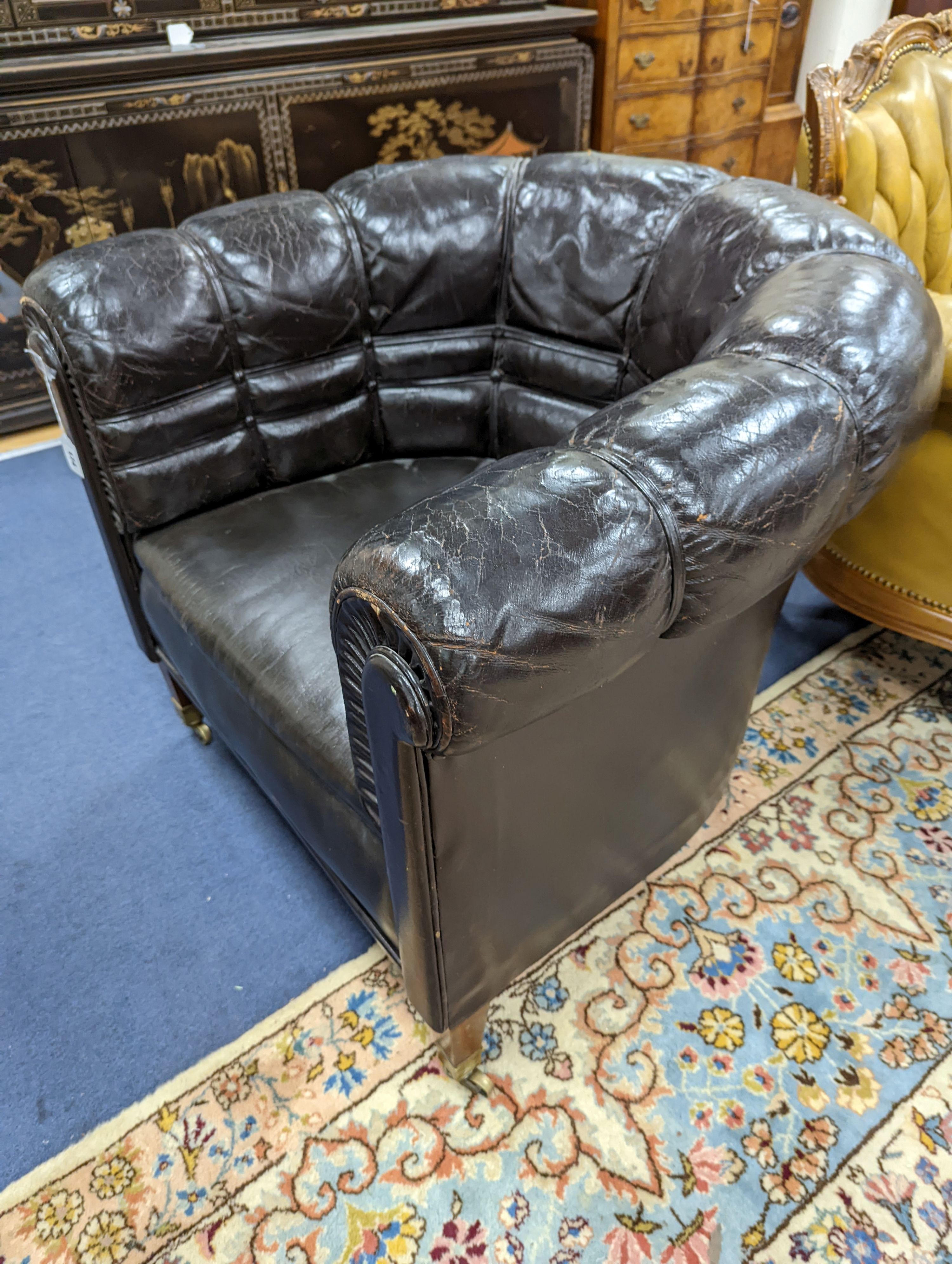 A black leather tub framed club armchair, width 88cm, depth 76cm, height 76cm